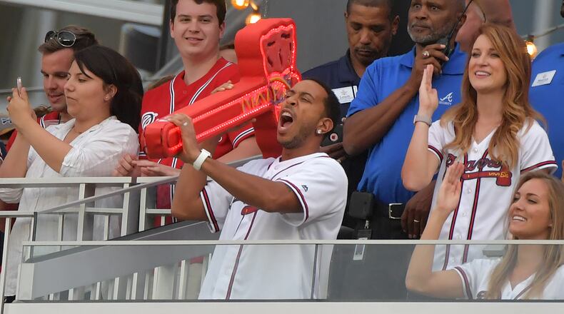 Ludacris leads the first chop from the Chop House during Atlanta Braves baseball game against the San Diego Padres at SunTrust Park on Saturday, April 15, 2017. HYOSUB SHIN / HSHIN@AJC.COM