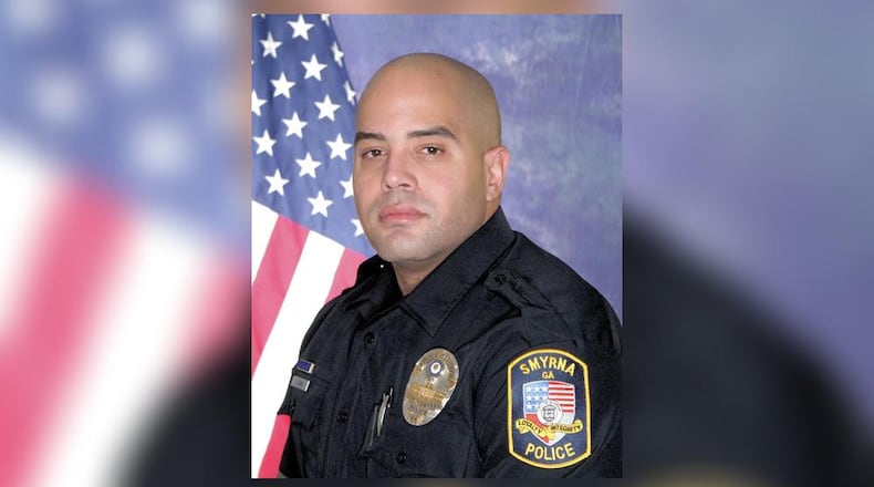 Officer Christopher Ewing was killed in a crash off South Cobb Drive.