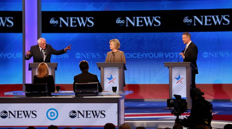 MANCHESTER, NH - DECEMBER 19: Democratic president candidates (L to R) Bernie Sanders, Hillary Clinton, and Martin O'Malley, debate at Saint Anselm College December 19, 2015 in Manchester, New Hampshire. This is the third Democratic debate featuring Democratic candidates Hillary Clinton, Bernie Sanders and Martin O'Malley. (Photo by Andrew Burton/Getty Images)