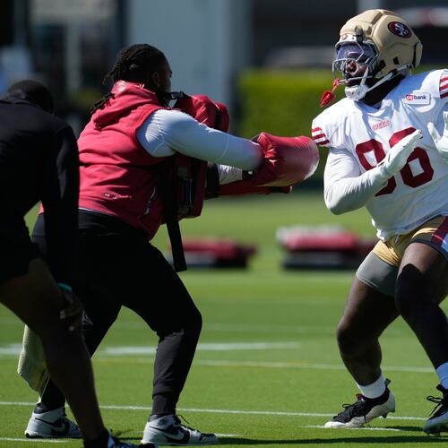 FILE - San Francisco 49ers' Cameron Sample, right, attends the NFL football team's training camp, July 31, 2026, in Santa Clara, Calif. (AP Photo/Jeff Chiu, File)