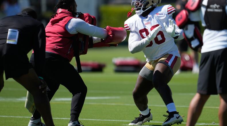 FILE - San Francisco 49ers' Cameron Sample, right, attends the NFL football team's training camp, July 31, 2026, in Santa Clara, Calif. (AP Photo/Jeff Chiu, File)