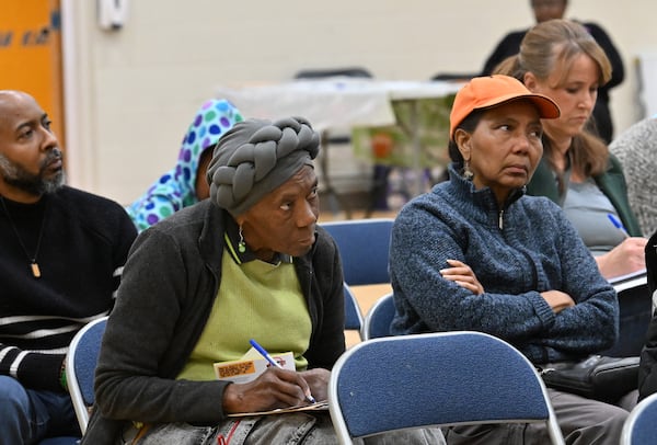 Attendees listen to presentations during a town hall by NPU-V and Digital Realty to discuss a planned data center in Atlanta at Dunbar Elementary School, Thursday, March 19, 2026, in Atlanta. (Hyosub Shin/AJC)