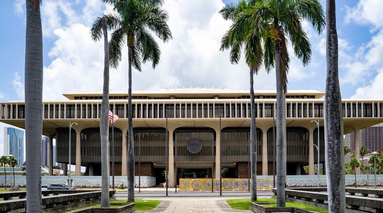 FILE - Palm trees frame the Hawaii State Capitol, April 23, 2025, in Honolulu, Hawaii. (AP Photo/Mengshin Lin, File)