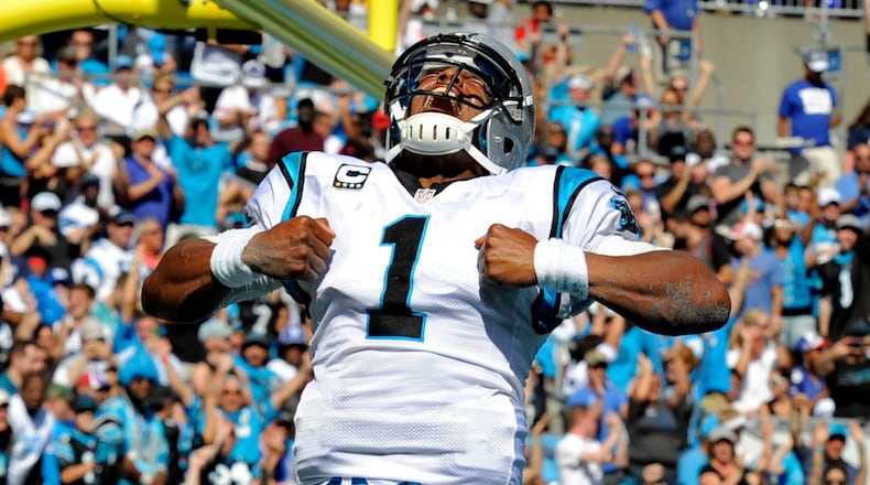 Carolina Panthers' Cam Newton (1) celebrates his touchdown run against the New York Giants during the second half of an NFL football game in Charlotte, N.C., Sunday, Sept. 22, 2013. (AP Photo/Mike McCarn) Carolina quarterback Cam Newton celebrating after scoring a touchdown against the New York Giants last December. (Associated Press)