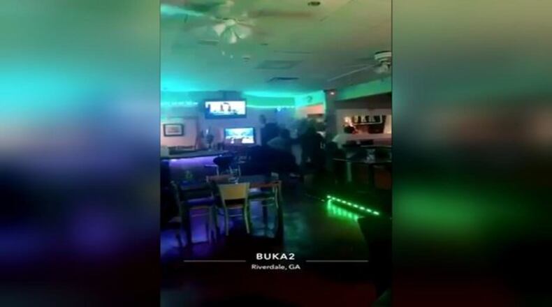 A customer at a Riverdale restaurant says the manager's son pulled a gun on her and her friends.