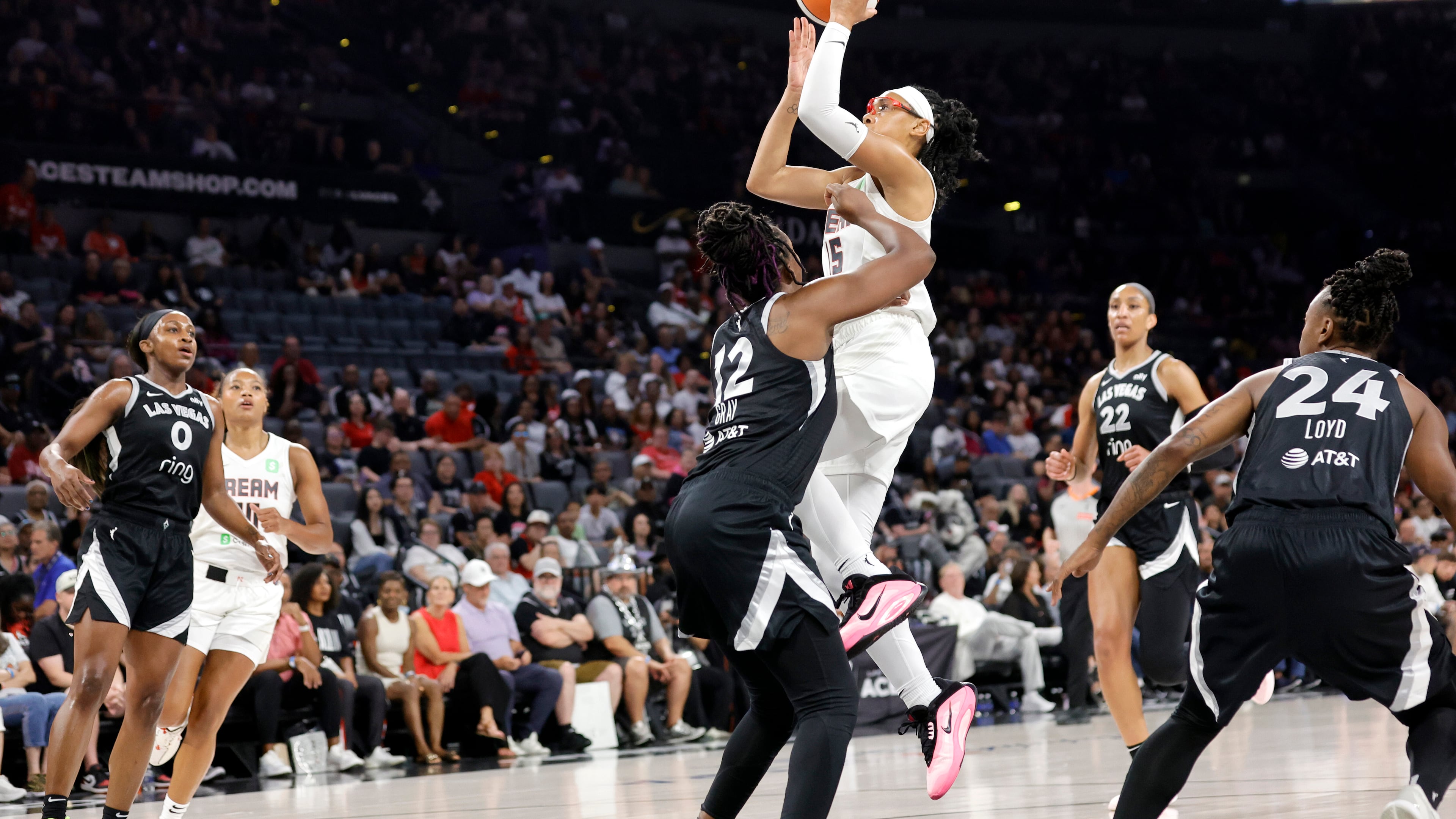 Atlanta Dream guard Allisha Gray, who scored 27 points in Thursday's win over the Minnesota Lynx, shoots over Las Vegas Aces guard Chelsea Gray (12) during the first half of a WNBA basketball game, Tuesday, Aug. 19, 2025, in Las Vegas. (Steve Marcus/Las Vegas Sun via AP)