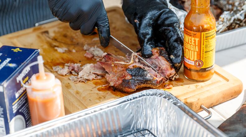 The Pigs & Peaches BBQ Festival will be held Aug. 23-24 at Adams Park in Kennesaw. Credit: Christopher Nowak/city of Kennesaw