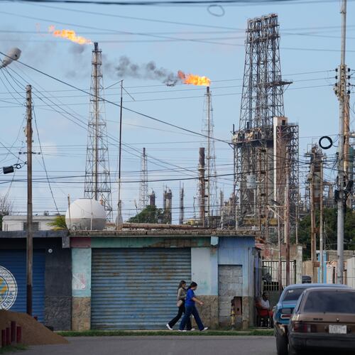 Flames rise from flare stacks at the Amuay refinery in Los Taques, Venezuela, Wednesday, Jan. 14, 2026. (AP Photo/Matias Delacroix)