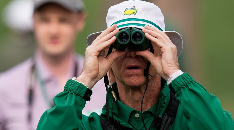 A course worker watches during a practice round ahead of the Masters golf tournament at the Augusta National Golf Club, Tuesday, April 7, 2026, in Augusta, Ga. (AP Photo/Eric Gay)