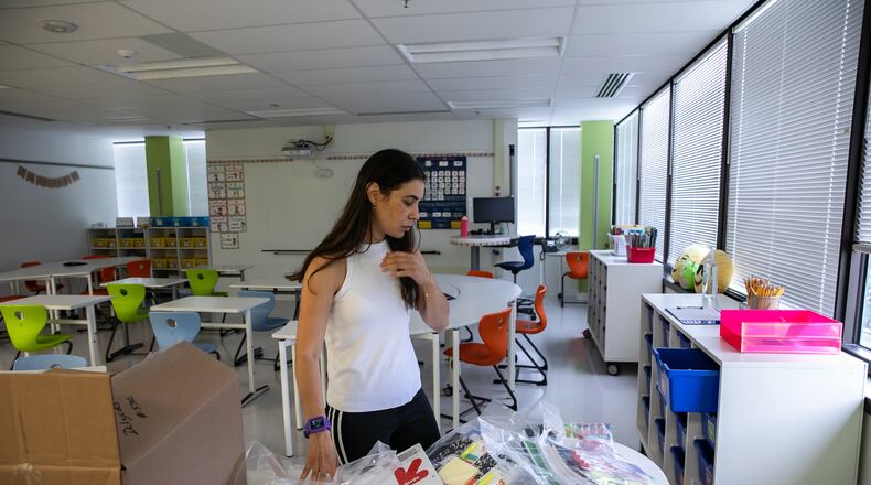 Fourth-grade teacher Desiree Delgado prepares school supplies for her Spanish immersion students at Bailey's Upper Elementary School on Aug. 10. MUST CREDIT: Photo for The Washington Post by Valerie Plesch.