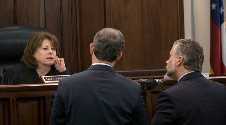 Cobb County Superior Court Judge Mary Staley Clark, left, confers with defense attorney Maddox Kilgore, right, and prosecutor Chuck Boring at the Ross Harris murder trial in Brunswick. (Stephen B. Morton for The Atlanta Journal Constitution)