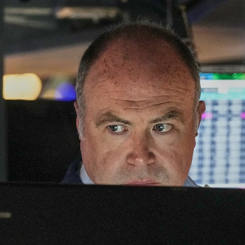 Trader Derek Orth works on the floor of the New York Stock Exchange, Thursday, April 30, 2026. (AP Photo/Richard Drew)