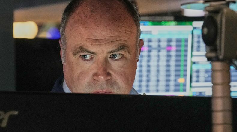 Trader Derek Orth works on the floor of the New York Stock Exchange, Thursday, April 30, 2026. (AP Photo/Richard Drew)