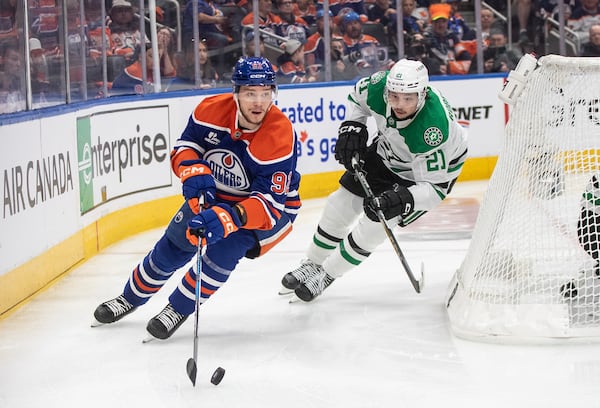 Dallas Stars' Jason Robertson (21) chases Edmonton Oilers' Vasily Podkolzin (92) during the nsecond period of Game 3 of the NHL hockey Stanley Cup Western Conference final in Edmonton, Alberta, Sunday, May 25, 2025. (Jason Franson/The Canadian Press via AP)