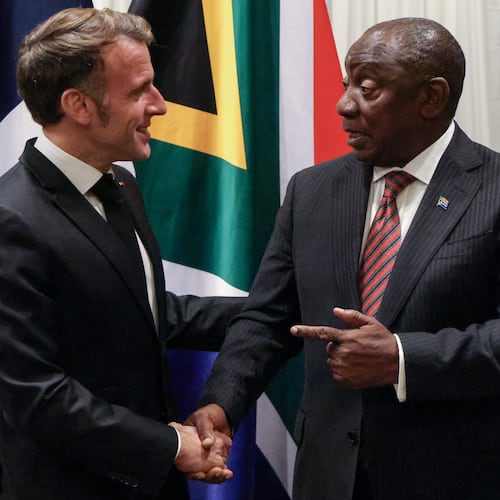France's President Emmanuel Macron, left, shakes hands with South Africa's President Cyril Ramaphosa during their bilateral meeting at the Sandton Convention Centre in Sandton, South Africa, Friday Nov. 21, 2025, ahead of the G20 leaders' Summit. (Ludovic Marin/Pool Photo via AP)