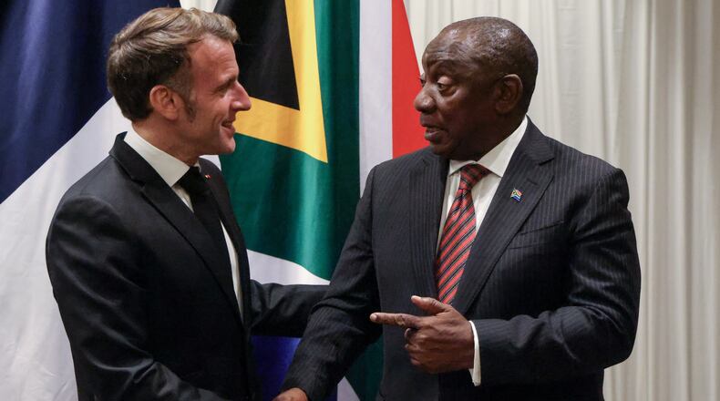 France's President Emmanuel Macron, left, shakes hands with South Africa's President Cyril Ramaphosa during their bilateral meeting at the Sandton Convention Centre in Sandton, South Africa, Friday Nov. 21, 2025, ahead of the G20 leaders' Summit. (Ludovic Marin/Pool Photo via AP)