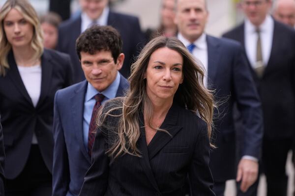 Karen Read arrives with her defense team for her trial at Norfolk Superior Court, Tuesday, April 22, 2025, in Dedham, Mass. (AP Photo/Charles Krupa)