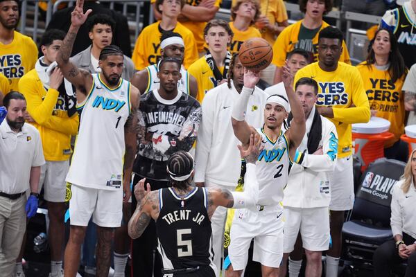 Indiana Pacers guard Andrew Nembhard (2) shoots the ball over Milwaukee Bucks guard Gary Trent Jr. (5) during the second half in Game 5 of an NBA basketball first-round playoff series in Indianapolis, Tuesday, April 29, 2025. (AP Photo/Michael Conroy)