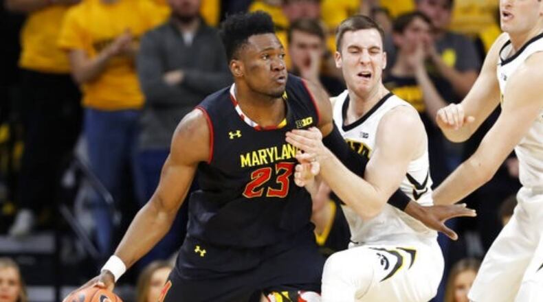 Bruno Fernando (23) drives past Iowa guard Connor McCaffery during the second half of Tuesday night's game.