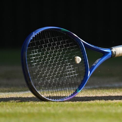 FILE - A tennis racket sits on the court at the Wimbledon Tennis Championships in London, July 11, 2026. (AP Photo/Kirsty Wigglesworth, File)