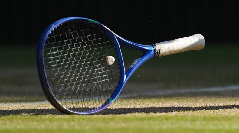FILE - A tennis racket sits on the court at the Wimbledon Tennis Championships in London, July 11, 2026. (AP Photo/Kirsty Wigglesworth, File)