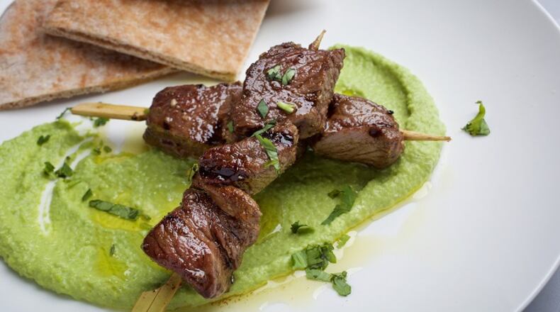 Pea Hummus With Grilled Marinated Lamb. MUST CREDIT: Photo by Deb Lindsey for The Washington Post.