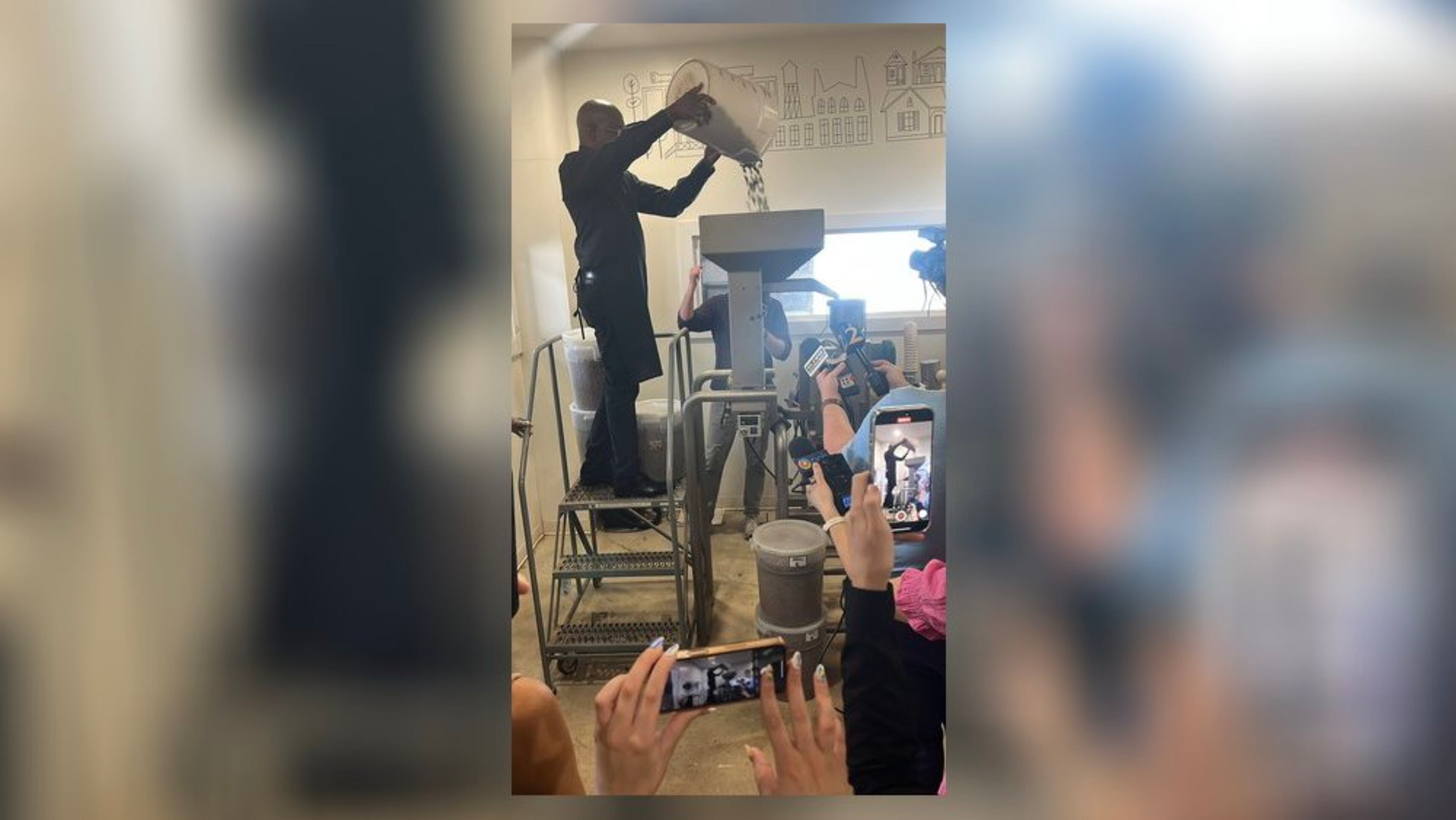 U.S. Sen. Raphael Warnock, D-Ga., did a little work while visiting Xocolatl Chocolate factory in Atlanta on Tuesday.