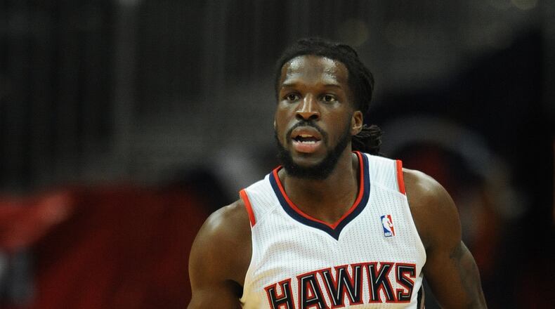 Atlanta Hawks DeMarre Carroll dribbles the basketball against the Sacramento Kings on Wednesday, December 18, 2013, in Philips Arena. The Hawks won the game 124 to 107 and Korver had 28 points.