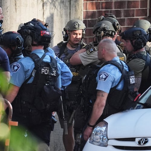 Law enforcement respond to a shooting Wednesday, Sept. 2, 2026, in downtown Minneapolis. (AP Photo/Ellen Schmidt)