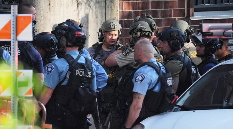 Law enforcement respond to a shooting Wednesday, Sept. 2, 2026, in downtown Minneapolis. (AP Photo/Ellen Schmidt)