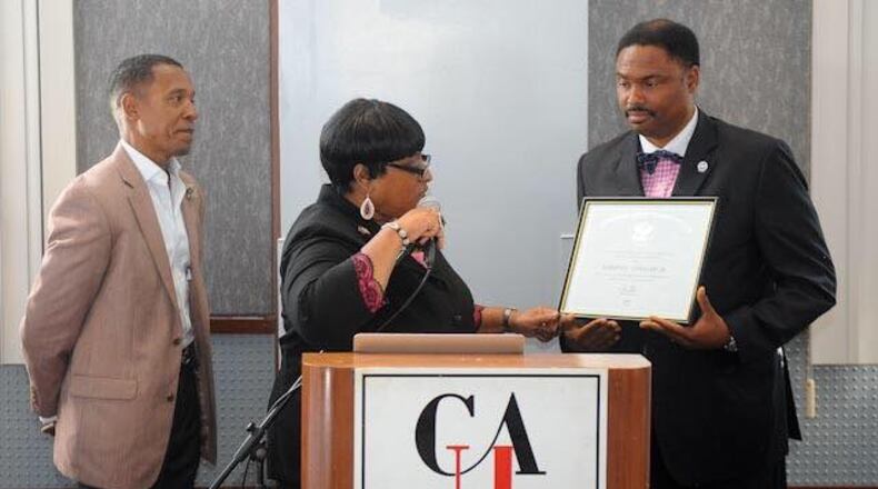 Marshall Taggart, right, was honored by President Barack Obama with an award for volunteer service.