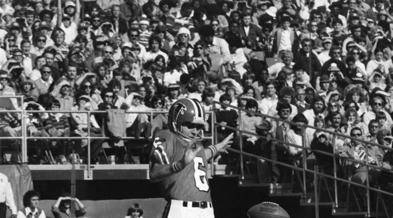 John James booms a punt for the Falcons. AJC file photo