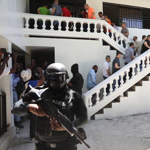 FILE - Colombians and Haitians who are accused of involvement in the 2021 assassination of Haitian President Jovenel Moise are escorted in handcuffs to their court hearing in Port-au-Prince, Haiti, May 26, 2025. (AP Photo/Odelyn Joseph, File)