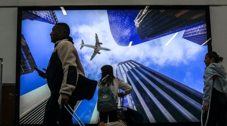 November 17, 2023 Hartsfield-Jackson International Airport: Air Travelers filled the airport Friday, Nov. 17, 2023 as the busy holiday period comes as the airport is in the midst of an array of construction projects that have caused disruptions for travelers. One project has just been completed: New escalators and elevators on Concourse T to the Plane Train tunnel was to be opened Friday. For Atlanta-based Delta Air Lines, Friday marked its busiest day of the Thanksgiving travel period, with large crowds also expected the Sunday and Monday after the holiday. Delta is now advising travelers to get to the airport three hours before their flights, instead of two hours as in the past. That’s due to long security waits and parking shortages at Hartsfield-Jackson International Airport. Delta expects Thanksgiving customer volumes are expected to be up 6% compared with last year. However, the traffic is spread out over more more than a week and a half, and the busiest days are still not expected to top peak days in July, according to Miller. Of the 16 busiest days in history for checkpoint screening at Hartsfield-Jackson, 15 of them were this year, according to Miller. The only time there have been more passengers at security checkpoints was the record day on the Monday after the Super Bowl in Atlanta in 2019, when nearly 102,000 passengers were screened at Hartsfield-Jackson.  To help handle the influx of passengers for holiday travel, Delta is calling back to work 300 seasonal employees in Atlanta, to help customers with checking bags, wheelchairs and unaccompanied minors. One key obstacle continues through the Thanksgiving travel period: There are four lanes closed off at the main security checkpoint, reducing the number of passengers that can be screened each hour at the airport. The lanes are closed for a construction project to replace baggage screening equipment at the checkpoint, and the work underway for more than a year isn’t expected to be completed until after Thanksgiving. (John Spink / John.Spink@ajc.com)