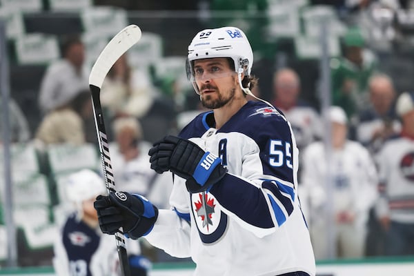 Winnipeg Jets center Mark Scheifele warms up before Game 6 of a second-round NHL hockey playoff series against the Dallas Stars in Dallas, Saturday, May 17, 2025. (AP Photo/Gareth Patterson)