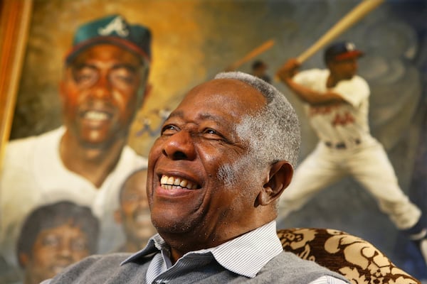 The late Braves legend Hank Aaron breaks into a smile on the eve of his 80th birthday in 2014.
