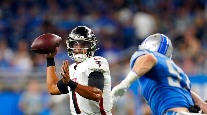 Atlanta Falcons quarterback Marcus Mariota is pressured during the first half of a preseason NFL football game against the Detroit Lions, Friday, Aug. 12, 2022, in Detroit. (AP Photo/Paul Sancya)