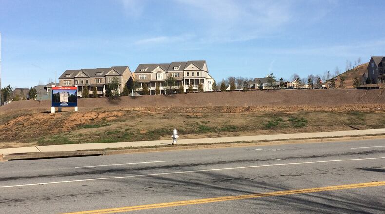 Alstead is a townhome community that backs up to what is currently an empty lot in Roswell. Plans are for an Aldi to be built in that lot.