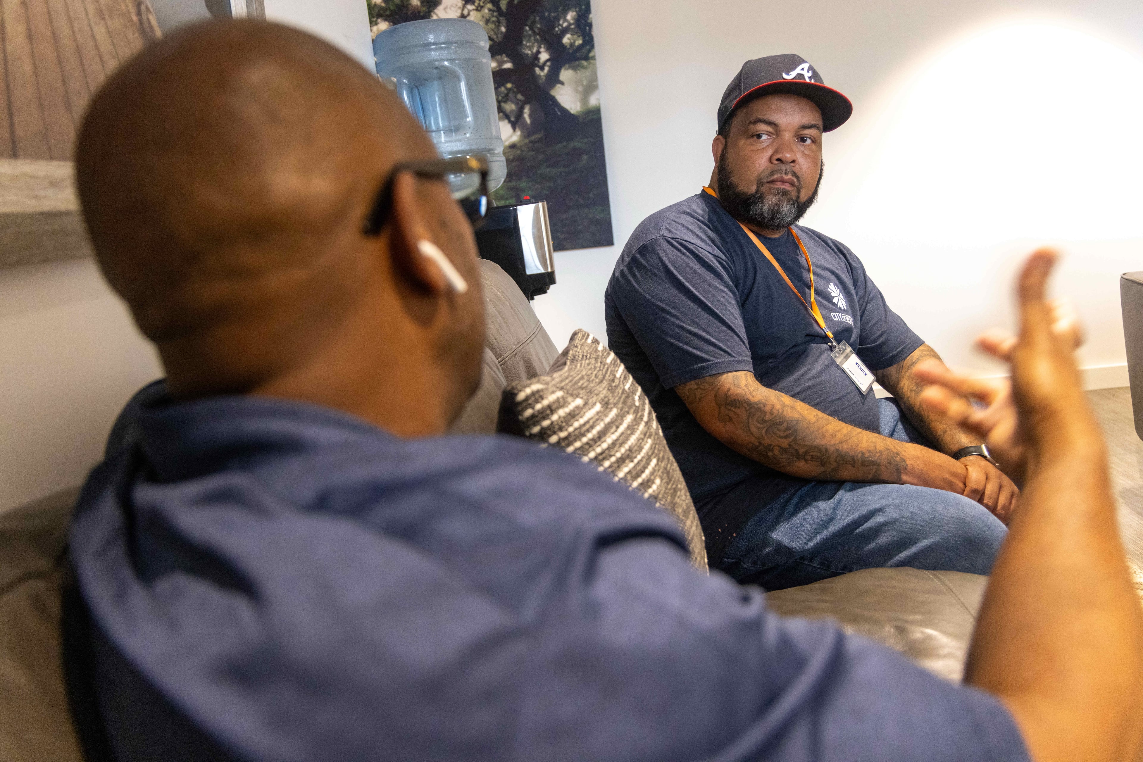Greg Washington (left) met QuinKnoca Owens (right) when Owens was in jail awaiting parole and knew he could be successful working for the City of Refuge. (Phil Skinner for the AJC)