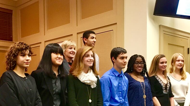 Decatur’s first ever youth council, recently sworn during a city commission meeting, shown here with Mayor Patti Garrett in the back row. The council’s comprised of nine students from Decatur High and Academe of the Oaks. All must live within city limits. Bill Banks for the AJC