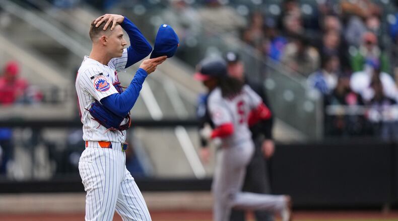 New York Mets pitcher Luke Weaver, left, reacts as Washington Nationals' CJ Abrams runs the bases after hitting a two run home run during the eighth inning of a baseball game Thursday, April 30, 2026, in New York. (AP Photo/Frank Franklin II)