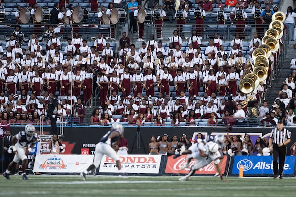 Alabama A&M fans and members of the Marching Maroon and White band had reason to celebrate as the Bulldogs rallied from a 20-7 deficit against Howard to take a 24-23 lead in the MEAC/SWAC Challenge Kickoff in Atlanta on Saturday, Aug. 29, 2026. The Bison ultimately pulled out the victory, 31-24. (Ben Gray for the AJC)