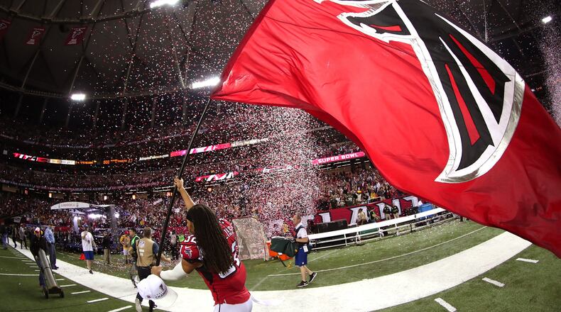 Jalen Collins of the Falcons celebrates with a Falcons flag after defeating the Green Bay Packers in the NFC Championship Game at the Georgia Dome on January 22, 2017 in Atlanta, Georgia. The Falcons defeated the Packers 44-21. (Photo by Tom Pennington/Getty Images)
