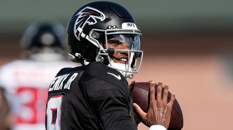 Falcons quarterback Michael Penix Jr. works out during training camp Monday, Aug. 3, 2026, in Flowery Branch. Penix has not been cleared for 11-on-11 sessions after knee surgery and said his doctor set the timeline at four weeks until he’d be fully cleared. (Mike Stewart/AP)