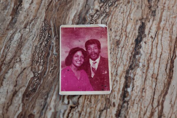 Views of a photograph of Betty and Glenn Madison from the early 1980s shown on Thursday, Feb. 12, 2026. The couple met in 1957 and have been married for 65 years. (Natrice Miller/AJC)
