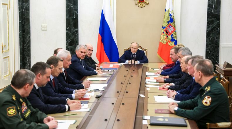 Russian President Vladimir Putin chairs a meeting with members of the Security Council in Moscow, Russia, Wednesday, Nov. 5, 2025. (Gavriil Grigorov, Sputnik, Kremlin Pool Photo via AP)