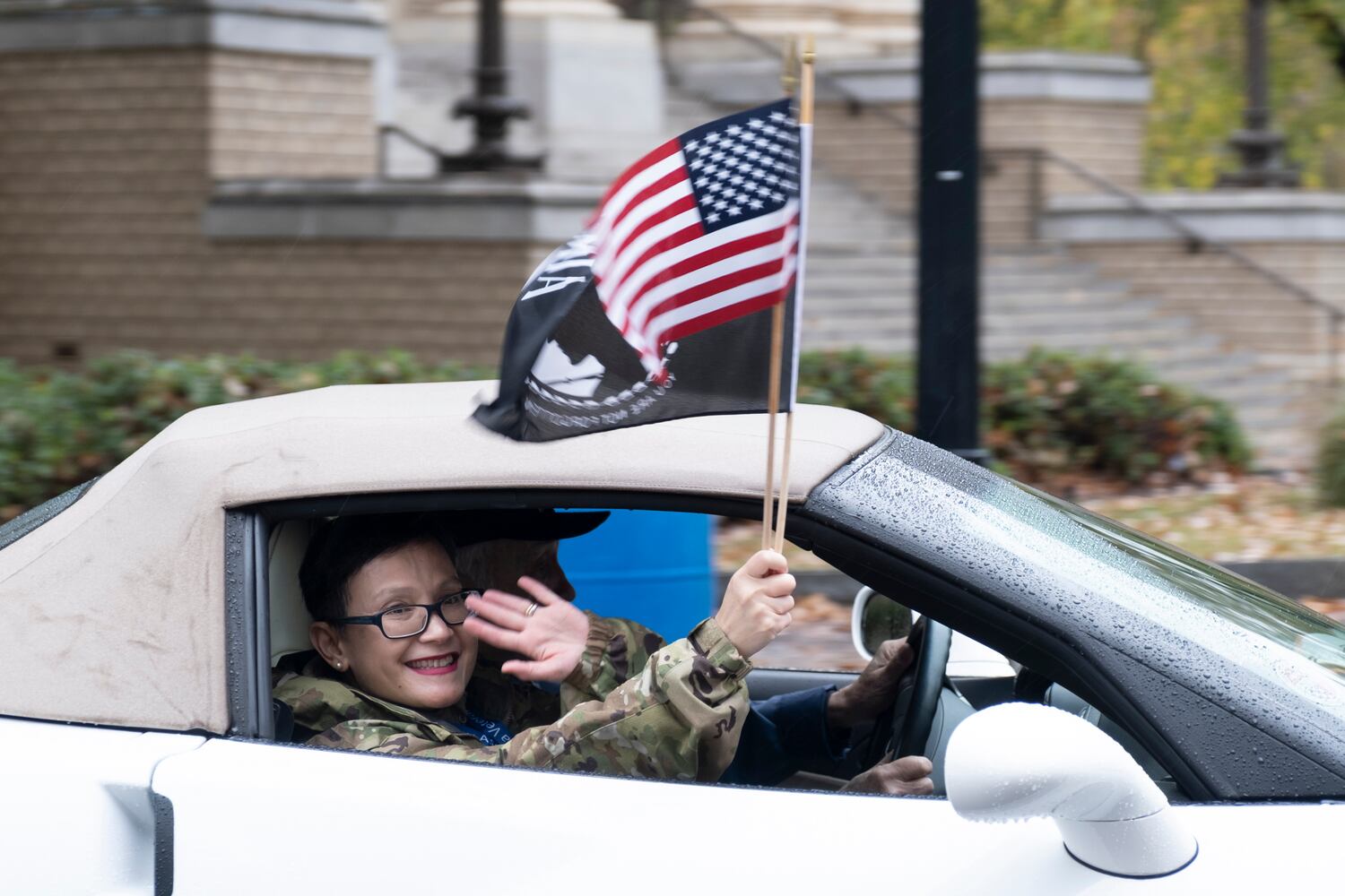 Parade judge Maj. Anna Sanchez waves at the start of the 42nd annual Georgia Veterans Day Parade in Midtown Atlanta on Saturday, Nov. 11, 2023.   (Ben Gray / Ben@BenGray.com)