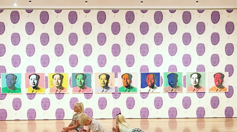 Three children take in the sights of the Andy Warhol exhibit at the High Museum.