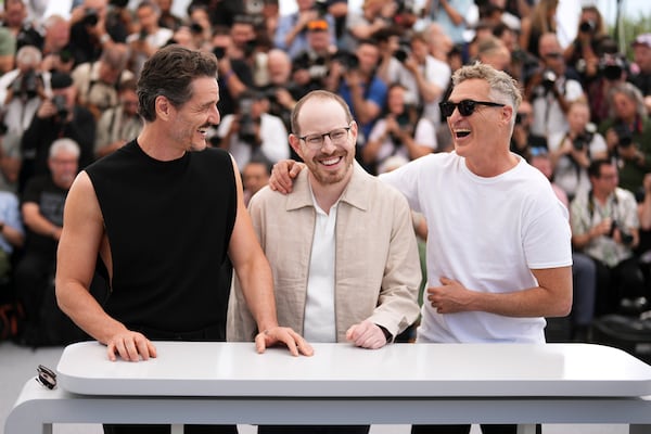 FILE - Pedro Pascal, from left, director Ari Aster and Joaquin Phoenix pose for photographers at the photo call for the film 'Eddington' at the 78th international film festival, Cannes, southern France, Saturday, May 17, 2025. (Photo by Scott A Garfitt/Invision/AP, File)