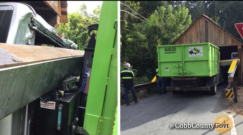 A dump truck struck the metal barrier protecting Cobb County's 145-year-old covered bridge on Tuesday, Sept. 4, 2018.